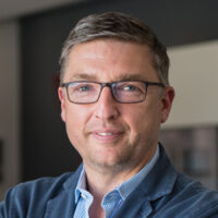 Lehmann, Geschäftsführer von Ideenherd GmbH, ein weißer Mann mittleren Alters mit kurzen braunen Haaren und einer Brille.