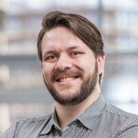 Andreas Siewert, Softwareentwickler bei BREDEX, ein weißer junger Mann mit kurzen braunen Haaren und Bart.
